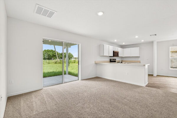 The living and kitchen areas in the Palmetto floorplan from the Value Collection by Holiday Builders