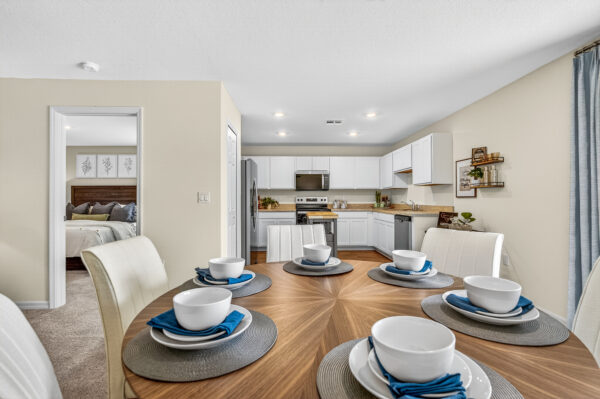 The dining and kitchen areas in the Queen floorplan from the Value Collection by Holiday Builders
