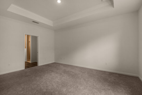 The master bedroom in the Rosemary floorplan from the Cornerstone collection by Holiday Builders.