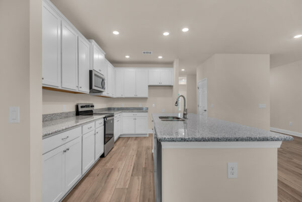 The kitchen in the Rosemary floorplan from the Cornerstone Collection by Holiday Builders.