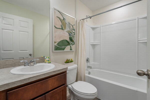 The guest bath in the Royal floorplan from the Value collection by Holiday Builders.