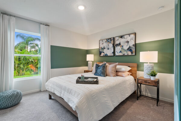 The guest bedroom in the Royal floorplan from the Value collection by Holiday Builders.