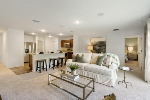 The living and kitchen areas in the Royal floorplan from the Value collection by Holiday Builders.