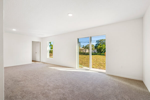 The living area in the Sago floorplan from the Value collection by Holiday Builders.