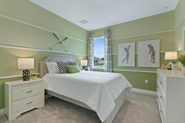 A golf themed bedroom in the Sanibel floorplan from the Cornerstone collection by Holiday Builders.