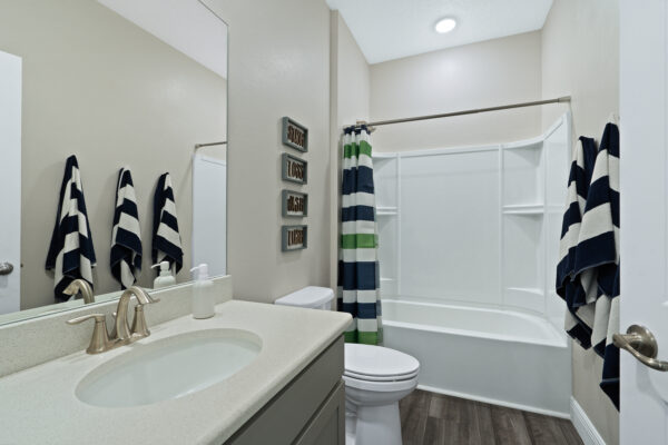 The guest bath in the Sanibel floorplan from the Cornerstone collection by Holiday Builders.