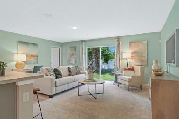 The living area in the Sylvester floorplan from the Value collection by Holiday Builders.