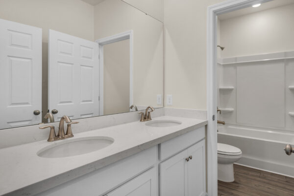 The guest bath in the Walton floorplan from the Cornerstone Collection by Holiday Builders.